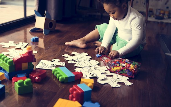 african-descent-kid-enjoying-puzzles-PGJQEXS.jpg